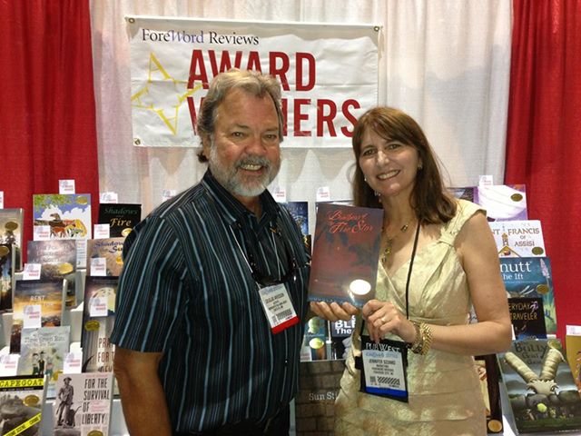Douglas Arvidson standing with Jennifer Szunko of ForeWord Reviews