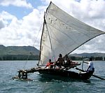 Canoe sailing.